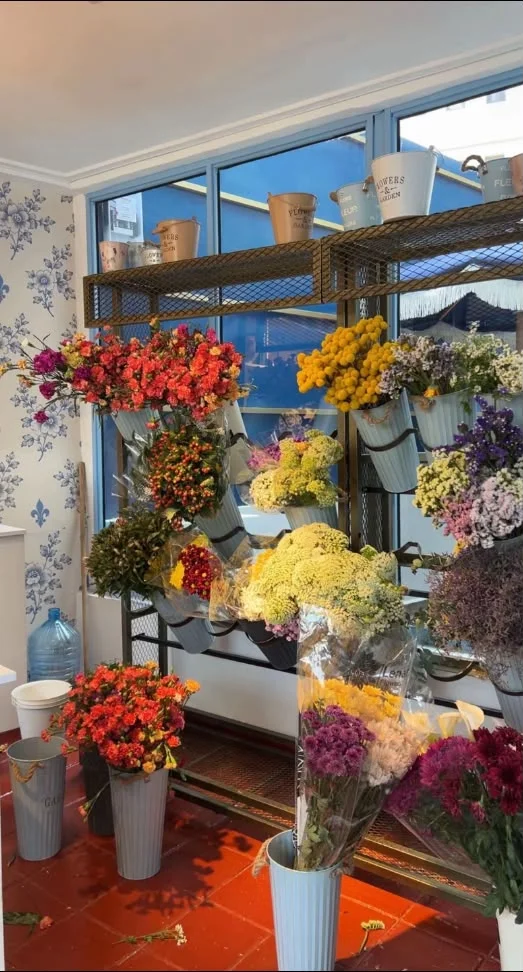 Racks of flowers waiting for the day's tables